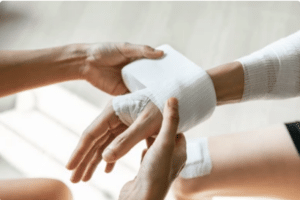 A dog bite victim getting their hand bandaged. Nevada has no specific dog bite statute.