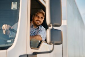 driver standing outside 18-wheeler