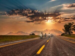 bikers riding on desert highway