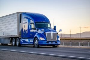 blue delivery truck on the road