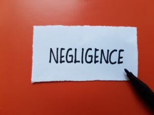 negligence written on red background