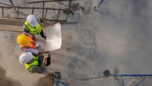 Three workers at a construction site. What is the number one construction hazard?