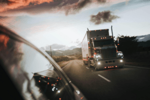 A truck driver driving slowly due to fatigue.