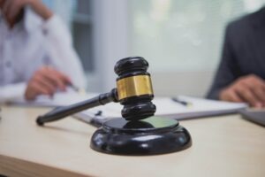 wo lawyers talking behind a gavel. What assets cannot be touched in a lawsuit?