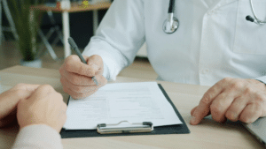 A doctor taking medical records after a car accident.