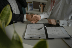 Lawyers agreeing on a settlement in a car accident case.