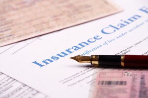 A paper on a clipboard that says “insurance.” What not to say to the insurance adjuster.